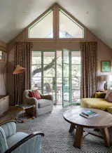 The ground-up residence by Studio Momentum is sited around a large live oak tree, shaping a quiet, shaded courtyard between it and a new ADU. The street-facing exterior reflects the area’s historic vernacular through its scale and materiality, while the modern interiors are infused with personality through antique and reclaimed furniture in every room.