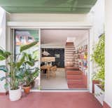 The reddish stone tile and corresponding paint is a references to tomette, a popular French terracotta tile.