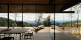 A roof overhang on the west side of the home protects it from wind and sun.