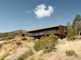 Given the site’s hard-to-reach location, it was less expensive and easier to reuse the concrete foundation rather than attempt to drive a concrete truck up the winding former stagecoach road.