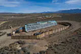 This self-sufficient Earthship is currently listed for $635K. The house is 2,000-square-feet with 3 bedrooms and 2 bathrooms.