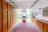The wood built-ins were designed by the original owner, furniture designer Chaim Schreiber. 