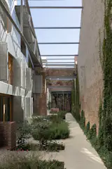 The private courtyard at the loft's entry offers respite from the neighborhood's active streets.