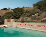 The original pool and diving board have been preserved.&nbsp;