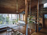 A Curvy Catwalk Dotted With Plants Buffers a Tokyo Home From the Street