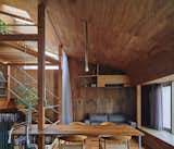A Curvy Catwalk Dotted With Plants Buffers a Tokyo Home From the Street
