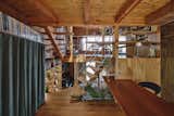 A Curvy Catwalk Dotted With Plants Buffers a Tokyo Home From the Street