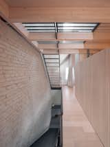 You’d Never Believe This Angular Glass Facade Stands Among Former Military Barracks