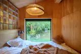Both bedrooms have custom beds from Edwood that are designed to fit the odd dimensions of the semicircular home.