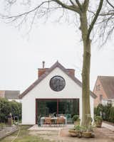 Timber Structures Pull Triple Duty Inside This Belgian Home for a Retired Couple