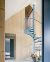 Timber Structures Pull Triple Duty Inside This Belgian Home for a Retired Couple