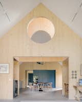 Timber Structures Pull Triple Duty Inside This Belgian Home for a Retired Couple