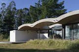 A Wave of Concrete Caps This Glass-Walled Home in Argentina
