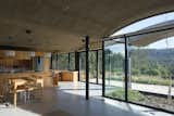 A Wave of Concrete Caps This Glass-Walled Home in Argentina