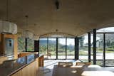 A Wave of Concrete Caps This Glass-Walled Home in Argentina