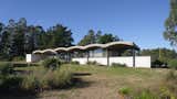 A Wave of Concrete Caps This Glass-Walled Home in Argentina