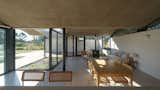 A Wave of Concrete Caps This Glass-Walled Home in Argentina