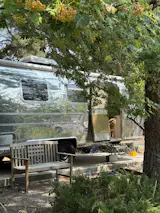 This 1975 Overlander camper has been revitalized with a snow-white interior, custom cabinetry, and zellige tile.