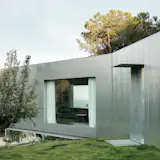Wood Prefab Panels Cloaked in Galvanized Steel Form a Hillside Home in Barcelona - Photo 5 of 14 - 