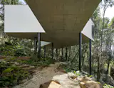 This 5,382-Square-Foot Home in Brazil Weaves Through the Forest on a Network of Piles - Photo 11 of 11 - 