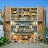 Massive Concrete Screens Bring Plenty of Light and Air to This Sandwiched-In Brazilian Home