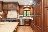 The kitchen comes with a new Miele dishwasher. 