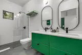 Three bathrooms have walk-in showers, while the fourth features a soaking tub.