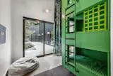 A custom bed accommodates not two but three bunks.&nbsp;