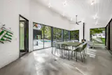 The screened-oin porch can comfortably seat 10 guests.&nbsp;
