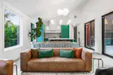 Green accents brighten up the home’s interior.&nbsp;