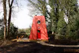 This Tiny Red Cabin Has a Lockbox for Your Phone