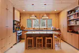 An oversized island anchors the chef's kitchen.