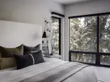 The window placements balance the risk of temperature swings—which demands more artificial heating and cooling—with the room and its location within the house.