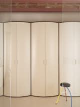 A Wavy Wardrobe Echoes Original Barrel Vaulted Ceilings in This Renovated Barcelona Flat