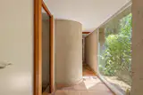 The layout consists of a series of segmented volumes oriented toward the landscape. 