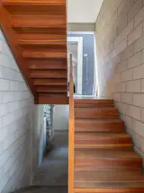 The three-level house is organized around a custom wood staircase.
