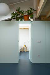 The Staircase in This Renovated Spanish Flat Is Also a Storage Unit—and a Kitchen