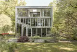 MVRDV combined nine visually distinct units to form a multifaceted home surrounded by gardens and apple orchard.