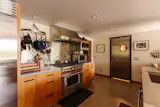 The kitchen, complete with appliances from Wolf, Sub-Zero, and Bosch, connects  to an outdoor grill.&nbsp;&nbsp;