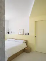 The couple's bed is from Habitat. It also has hidden storage.