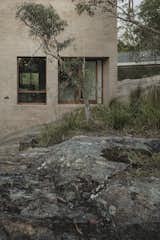 At an Australian Home Built Into a Cliff, You Enter Via the Footbridge