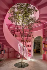 A Pink Stair With an Atrium and Bookshelves Revives This 1930s Mexico City Home