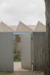 A Sawtooth Roof With Skylights Caps the Living Space of This Melbourne Home