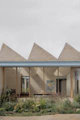 A Sawtooth Roof With Skylights Caps the Living Space of This Melbourne Home