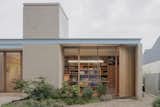 A Sawtooth Roof With Skylights Caps the Living Space of This Melbourne Home