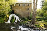 A Waterfall Rushes Through This $5.25M Mill Turned Residence in Upstate New York