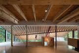 A Massive New Roof Turns a ’70s Chalet in Canada Into a Forest Palace