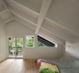 A Massive New Roof Turns a ’70s Chalet in Canada Into a Forest Palace