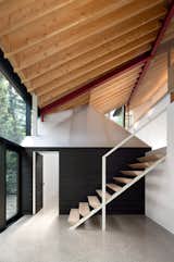 A Massive New Roof Turns a ’70s Chalet in Canada Into a Forest Palace