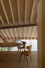 A Massive New Roof Turns a ’70s Chalet in Canada Into a Forest Palace